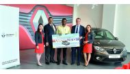 Hameed Bhathusha Nainamohamed, winner of Renault’s Ramadan campaign, receiving the prize from officials concerned. 
