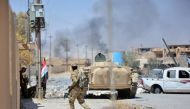 Shi'ite Popular Mobilization Forces (PMF) members and Iraqi army are seen during clashes with Islamic State militants at Al Jazeera neighbourhood of Tal Afar, Iraq, August 23, 2017. REUTERS/Stringer 