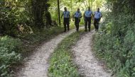 French gendarmes search for evidences on August 29, 2017 in the area around Pont-de-Beauvoisin, eastern france, after Maelys, a 9-year-old girl, disappeared during a wedding party two days ago. AFP / Philippe Desmazes