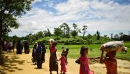 Rohingya refugees walk pass Balukhali refugee camp near Myanmar border in Bangladesh on August 27, 2017. AFP / Sam Jahan