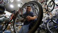 A man repairs a bike wheel at a bicycle shop in Beirut, Lebanon August 30, 2017. REUTERS/ Mohamed Azakir