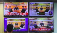 A South Korean official watches television news channels showing North Korea's leader Kim Jong-Un, at the Korea Meteorological Administration in Seoul on September 3, 2017. The 