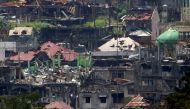 Damaged buildings and houses are seen as government troops continue their assault on its 105th day of clearing operations against pro-IS militants who have seized control of large parts of Marawi city, southern Philippines September 4, 2017. REUTERS/Romeo