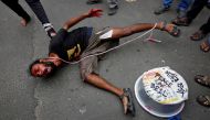 A demonstrator performs in a street play during a protest rally against killings of Rohingya people in Myanmar, near Myanmar consulate in Kolkata, India, September 4, 2017. Reuters/Rupak De Chowdhuri