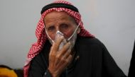 A man breathes through an oxygen mask after what activists said was a chlorine gas attack on Kansafra village at Idlib countryside, Syria May 7, 2015. (Reuters / Abed Kontar) 