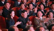This undated picture released by North Korea's official Korean Central News Agency (KCNA) on September 10, 2017 shows North Korean leader Kim Jong-Un (centre row 2nd L) and his wife Ri Sol-Ju (centre row L) attending an art performance dedicated to nuclea