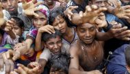 SEEKING AID. Rohingya refugees from Myanmar's Rakhine state wait for aid at Kutupalong refugee camp in the Bangladeshi town of Teknaf on September 5, 2017. K M Asad/AFP.