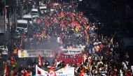 Demonstrators take part in a protest called by several French unions against the labour law reform in Marseille, southern France, on September 12, 2017.   AFP / ANNE-CHRISTINE POUJOULAT
