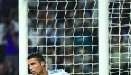 Real Madrid's Portugese forward Cristiano Ronaldo celebrates after scoring during the UEFA Champions League football match against APOEL FC at the Santiago Bernabeu Stadium in Madrid yesterday. Title holders Real won 3-0.