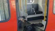 Personal belongings and a bucket with an item on fire inside it, are seen on the floor of an underground train carriage at Parsons Green station in West London, Britain September 15, 2017, in this image taken from social media. SYLVAIN PENNEC/via REUTERS 