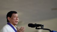 (FILES) This file photo taken on August 9, 2017 shows Philippine President Rodrigo Duterte gestures as he gives a speech during the 116th anniversary of the Philippine National Police (PNP) at its headquarters in Manila. AFP / NOEL CELIS

