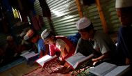 Rohingya refugee boys learn to recite the Quran in an Arabic school in Balukhali Makeshift Camp, in Cox's Bazar, Bangladesh, September 19, 2017. Reuters/Mohammad Ponir Hossain