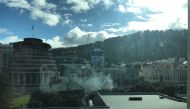 Smoke is rising near the parliament building in Wellington, New Zealand, September 21, 2017 in this social media picture. TWITTER Ô@PIPSSQUEAKSÕ via REUTERS
