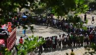 Rohingya Muslims, fled from ongoing military operations in Myanmar’s Rakhine state, stand in line to receive humanitarian aids at a makeshift camp in Teknaff, Bangladesh on September 22, 2017.  Zakir Hossain Chowdhury - AA
