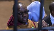 This file photo taken on June 28, 2017 shows Zimbabwean cleric and political activist Evan Mawarire arriving at the magistrate's court in Harare after he was detained for addressing and praying with striking University of Zimbabwe medical students. AFP / 