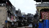 Government soldiers stand guard in front of damaged houses and building in Sultan Omar Dianalan boulevard at Mapandi district in Marawi city, southern Philippines September 13, 2017. Picture taken September 13, 2017. REUTERS/Romeo Ranoco
