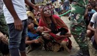 Rohingya refugees wait to receive aid in Cox's Bazar, Bangladesh, September 27, 2017. Reuters/Cathal McNaughton