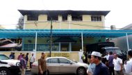 FILE PHOTO: Authorities work at religious school Darul Quran Ittifaqiyah after a fire broke out in Kuala Lumpur, Malaysia September 14, 2017. REUTERS/Lai Seng Sin/File Photo
