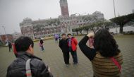 File photo of tourists in front of the presidential palace in Taipei. Reuters 
