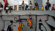 Students wear Esteladas (Catalan separatist flag) during a demonstration in favor of the banned October 1 independence referendum in Barcelona, Spain September 28, 2017. REUTERS/Jon Nazca