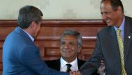 Chief Colombian negotiator Juan Camilo Restrepo (R) shakes hands with ELN negotiator Pablo Beltran as Ecuadoran President Lenin Moreno looks on in Quito last month. (Photo: AFP/Juan Cevallos).