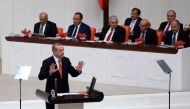 Turkish President Tayyip Erdogan addresses lawmakers at the Parliament in Ankara, Turkey, October 1, 2017. Yasin Bulbul/Presidential Palace/Handout via Reuters