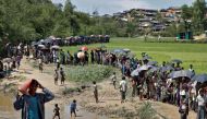 Rohingya refugees queue for aid in Cox's Bazar, Bangladesh, October 1, 2017. REUTERS/Cathal McNaughton.