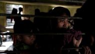 A newly arrived Rohingya refugee waits to be transferred to a camp in Cox's Bazar, Bangladesh, October 2, 2017. REUTERS/Cathal McNaughton 