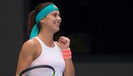 Sorana Cirstea of Romania celebrates winning her women's singles match against Karolina Pliskova of the Czech Republic at the China Open tennis tournament in Beijing on October 5, 2017. / AFP / Nicolas ASFOURI