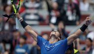 Rafael Nadal of Spain celebrates his win against John Isner of the U.S.. REUTERS/Jason Lee
