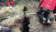 This handout pictured taken by Swiss Police of the Canton of Valais on October 4, 2017 shows the tiny crevasse from where a child fell in a six-metre (20-foot) deep cavity and was rescued after 12 hours of work near Aletsch glacier on October 5, 2017.  AF