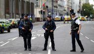 Police officers stand in the road outside the Natural History Museum, after a car mounted the pavement injuring a number of pedestrians, police said, in London, Britain October 7, 2017. REUTERS/Peter Nicholls