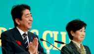 Japan's Prime Minister Shinzo Abe (L), who is also ruling Liberal Democratic Party leader, and Head of Japan's Party of Hope and Tokyo Governor Yuriko Koike attend a debate session ahead of October 22 lower house election at the Japan National Press Club 