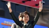 Tokyo Governor Yuriko Koike waves to the audience during an election campaign appearance at an entrance of a train station in Tokyo on October 10, 2017. Photo by Kazuhiro Nogi/AFP.