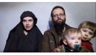 A still image from a video posted by the Taliban on social media on December 19, 2016 shows American Caitlan Coleman (L) speaking next to her Canadian husband Joshua Boyle and their two sons. Courtesy Taliban/Social media via REUTERS