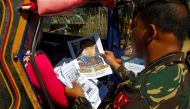 FILE PHOTO: Soldiers distribute pictures of a member of extremist group Abu Sayyaf Isnilon Hapilon, who has a U.S. government bounty of $5 million for his capture, in Butig, Lanao del Sur in southern Philippines February 1, 2017. REUTERS/Marconi B. Navale