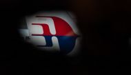 A Malaysia Airlines logo is pictured at Kuala Lumpur International Airport (KLIA) in Sepang on March 8, 2015. Mohd Rasfan/AFP.
