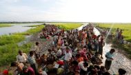 Rohingya refugees who crossed the border from Myanmar a day before, wait to receive permission from the Bangladeshi army to continue their way to the refugee camps, in Palang Khali, Bangladesh October 17, 2017. REUTERS/Jorge Silva