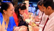 Indian expatriates purchasing gold at Malabar Gold and Diamonds showroom in Al Watan Center, yesterday, in view of Dhanteras and Diwali.  Pic: Abdul Basit / The Peninsula 