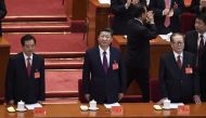 Chinese President Xi Jinping (C) and Chinese former president Hu Jintao (L), Chinese former president Jiang Zemin (2nd R) attend the opening session of the Chinese Communist Party's Congress at the Great Hall of the People in Beijing on October 18, 2017. 