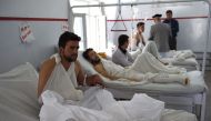 FILE PHOTO: A wounded Afghan police man looks on as he receives treatment following the militants raid that targeted the American University of Afghanistan on August 25. 2016 (AFP) 