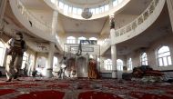Afghan men inspect inside a Shi'ite Muslim mosque after last night's attack in Kabul, Afghanistan October 21, 2017. REUTERS/Omar Sobhani
