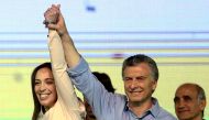 Argentina's President Mauricio Macri and Buenos Aires' governor Maria Eugenia Vidal hold hands as they celebrate at their campaign headquarters in Buenos Aires, Argentina October 22, 2017. REUTERS/Marcos Brindicci