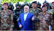 Iraqi Prime Minister Haider Al Abadi with army generals and members of the counter-terrorism forces in the capital Baghdad in this July 2016 file picture. 
