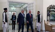 US Secretary of State Rex Tillerson (2R) walks with Pakistani Foreign Minister Khawaja Asif as he arrives at the Prime Minister's residence in Islamabad on October 24, 2017. AFP / Alex Brandon