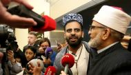 Irish citizen Ibrahim Halawa speaks to the press as he stands by his father Hussein Halawa after arriving at Dublin Airport on October 24, 2017 following his release from detention in Egypt. AFP / Paul Faith