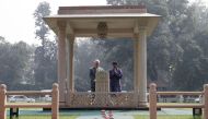 US Secretary of State Rex Tillerson (L) pauses for a moment at the Martyr's Column, the site of the 1948 assassination of Indian independence icon Mahatma Gandhi, next to the Gandhi Smriti director Dipankar Gyan in New Delhi on October 25, 2017./ AFP / PO