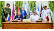 Minister of State for Defence Affairs H E Dr Khalid bin Mohamed Al Attiyah and Russian Defence Minister Sergey Shoygu signing an agreement. 