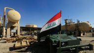 FILE PHOTO: An Iraqi flag is seen on a military vehicle at an oil field in Dibis area on the outskirts of Kirkuk, Iraq October 17, 2017. REUTERS/Alaa Al-Marjani/File Photo
