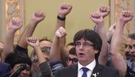 Catala president Carles Puigdemont (C) sings the Catalan anthem 